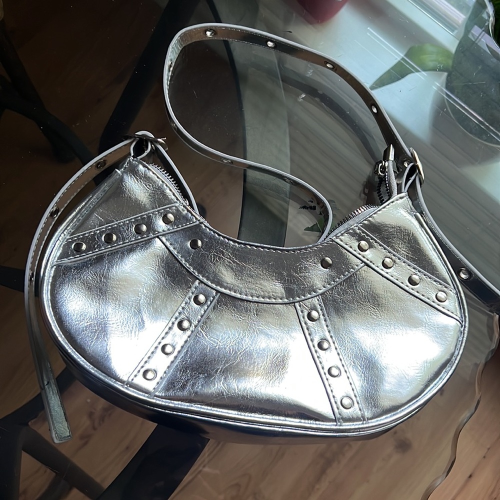 Silver Medium Handbag. Love this bag, fits my phone plus more.